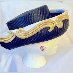 Adolfo II 90’s black straw hat with white, gold and pearl embellishments.
